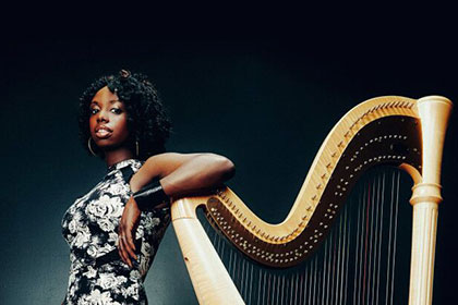 Brandee Younger pictured with harp