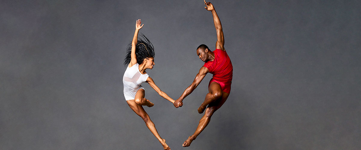 2 Actively Posed Dancers from Alvin Ailey American Dance Theater