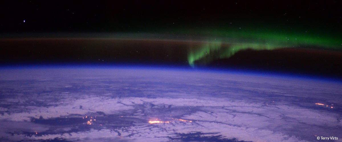 A view of Earth from space with the northern lights