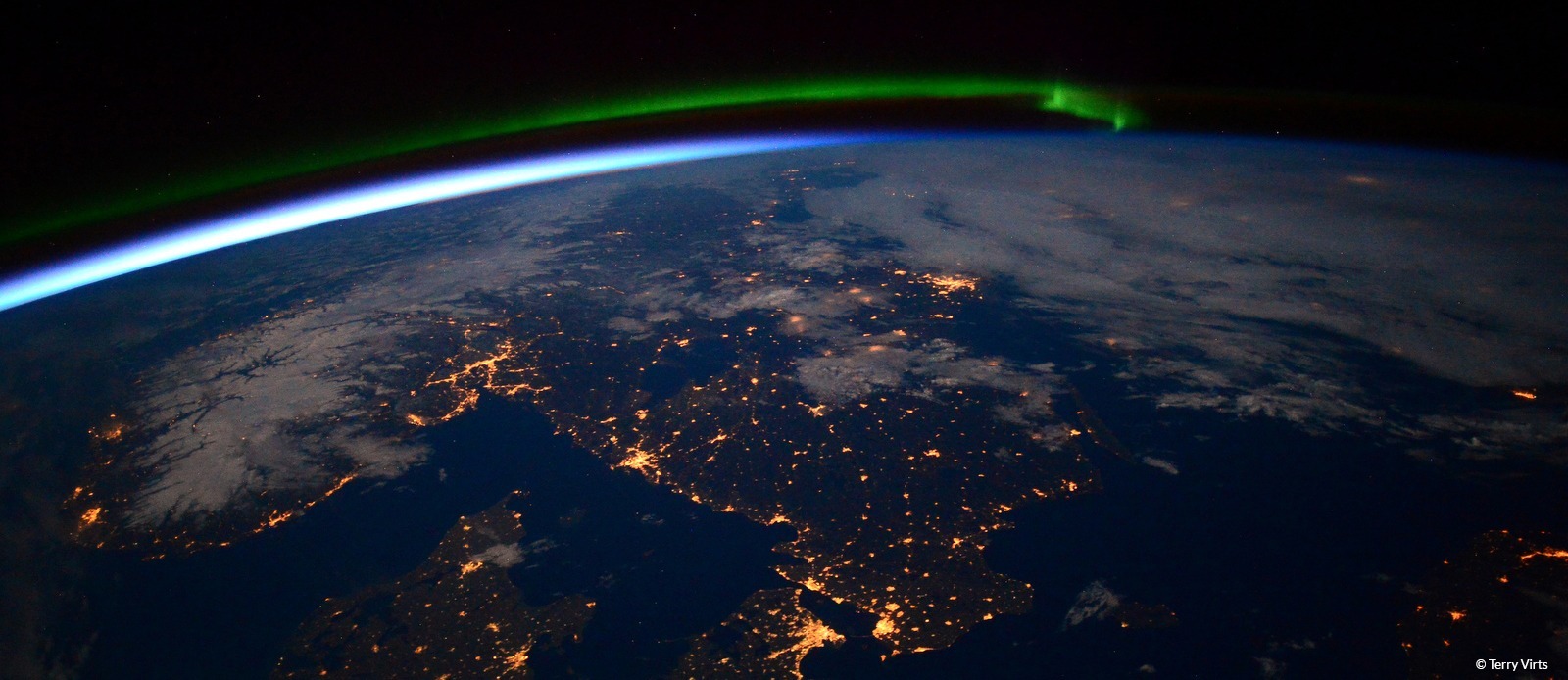 A view of earth from space with northern lights