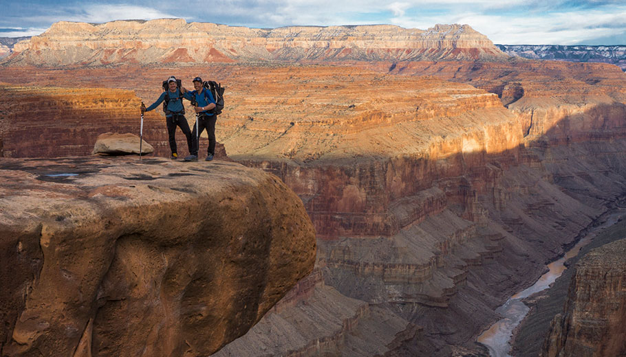 Kevin Fedarko and Pete McBride standing at the Grand Canyon