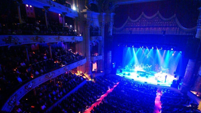 A full house watches a performance in the historic Academy of Music.